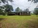 Charming single-story home features a well-maintained lawn and a cozy facade with black shutters at 6668 Prinston Cir, Douglasville, GA 30135