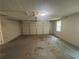 Interior of a one-car garage with a large door and overhead lighting at 6668 Prinston Cir, Douglasville, GA 30135