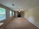 The living room features carpet, a fan and a fireplace at 6668 Prinston Cir, Douglasville, GA 30135