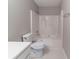 Bathroom featuring a shower-tub combination and a toilet with stylish flooring at , Lithonia, GA 30038