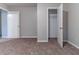 Bedroom with neutral walls, plush carpet, and open closet at , Lithonia, GA 30038