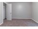 Bedroom with neutral walls, plush carpet, and open closet at , Lithonia, GA 30038