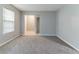 Cozy bedroom with soft carpet, neutral walls, and easy access to closet and bathroom for optimal comfort at , Lithonia, GA 30038