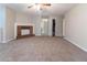 Inviting living room with cozy fireplace, plush carpeting, and versatile layout offers a welcoming atmosphere at , Lithonia, GA 30038