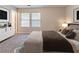 Cozy main bedroom with carpet, neutral walls, dresser, and well-lit lamp at , Lithonia, GA 30038