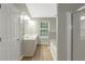 Bathroom featuring dual sinks, large vanity and a soaking tub at 1011 Riverclift Dr, Covington, GA 30016