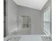 Bathroom featuring double sinks and a separate tub at 1011 Riverclift Dr, Covington, GA 30016