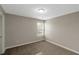 Well-lit bedroom featuring neutral walls and carpeted flooring at 1011 Riverclift Dr, Covington, GA 30016