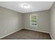 Cozy bedroom with a window offering natural light and view at 1011 Riverclift Dr, Covington, GA 30016