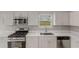 Modern kitchen features stainless steel appliances, including a range and microwave at 1011 Riverclift Dr, Covington, GA 30016