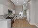 Modern kitchen with stainless steel appliances and plenty of cabinet space at 1011 Riverclift Dr, Covington, GA 30016