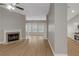 Cozy living area featuring modern floors and a classic fireplace at 1011 Riverclift Dr, Covington, GA 30016