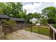 A wooden deck overlooking a tree-filled backyard, perfect for outdoor gatherings and relaxation at 1354 Mcpherson Se Ave, Atlanta, GA 30316