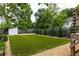 Green artificial grass with tasteful landscaping in this quaint backyard, offering easy maintenance at 1354 Mcpherson Se Ave, Atlanta, GA 30316