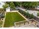 A backyard featuring freshly laid artificial turf and tasteful landscaping at 1354 Mcpherson Se Ave, Atlanta, GA 30316