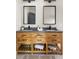 This bathroom features a wood vanity with double sinks and modern hardware at 1354 Mcpherson Se Ave, Atlanta, GA 30316