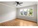 Empty bedroom features hardwood floors, a ceiling fan, and neighborhood views at 1354 Mcpherson Se Ave, Atlanta, GA 30316