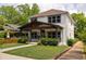 Charming two-story home featuring inviting front porch and manicured landscaping in a quiet neighborhood at 1354 Mcpherson Se Ave, Atlanta, GA 30316