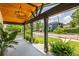 Welcoming front porch showcasing stained wood ceiling, modern lighting, and serene neighborhood views at 1354 Mcpherson Se Ave, Atlanta, GA 30316