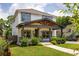 Charming two-story home with a welcoming covered porch, beautifully landscaped yard, and a well-maintained lawn at 1354 Mcpherson Se Ave, Atlanta, GA 30316