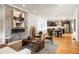 Elegant living room featuring a modern fireplace, hardwood floors, and seamless flow to the kitchen at 1354 Mcpherson Se Ave, Atlanta, GA 30316
