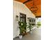 Inviting covered porch featuring a stylish chandelier, decorative plants, and elegant wall sconces that enhance curb appeal at 1354 Mcpherson Se Ave, Atlanta, GA 30316