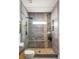 This bathroom features a luxurious walk-in shower with a stone accent wall at 1354 Mcpherson Se Ave, Atlanta, GA 30316