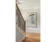 Elegant staircase featuring wooden steps, decorative railings and modern art at 1354 Mcpherson Se Ave, Atlanta, GA 30316