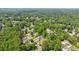 An aerial view of a neighborhood enveloped by lush greenery and mature trees, providing a serene environment at 1915 Cooper Landing Se Dr, Smyrna, GA 30080