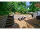 Relaxing backyard area with a privacy fence, gravel bed, and outdoor seating at 1915 Cooper Landing Se Dr, Smyrna, GA 30080