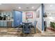 Dining area with a round table, hardwood floors, and direct access to the kitchen at 1915 Cooper Landing Se Dr, Smyrna, GA 30080