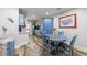 Cozy dining area with a round table, blue-painted chairs, and open access to kitchen at 1915 Cooper Landing Se Dr, Smyrna, GA 30080
