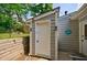 Exterior of the back of a house with light siding and a utility door at 1915 Cooper Landing Se Dr, Smyrna, GA 30080
