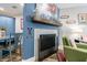 Living room with a decorative fireplace, mantel with decor, dining area and colorful furnishings at 1915 Cooper Landing Se Dr, Smyrna, GA 30080