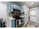 A cozy kitchen featuring modern appliances and light-colored cabinetry at 1915 Cooper Landing Se Dr, Smyrna, GA 30080