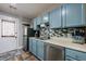 Well-lit kitchen with stainless appliances, mosaic backsplash, and wood-look flooring at 1915 Cooper Landing Se Dr, Smyrna, GA 30080