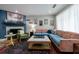 Bright living room with a fireplace, area rug, and comfortable seating with natural light at 1915 Cooper Landing Se Dr, Smyrna, GA 30080