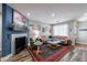 Cozy living room with fireplace, colorful rug, and comfortable seating at 1915 Cooper Landing Se Dr, Smyrna, GA 30080