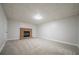 Finished basement features neutral carpet and a brick fireplace ready for you to move in at 4495 Riders Ridge Trl, Snellville, GA 30039