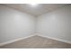 Small finished basement with neutral carpet ready to be turned into your bonus space at 4495 Riders Ridge Trl, Snellville, GA 30039
