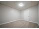 Finished basement with neutral carpet ready to be turned into your bonus space at 4495 Riders Ridge Trl, Snellville, GA 30039