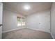 Finished basement with neutral carpet features light and a view of the backyard at 4495 Riders Ridge Trl, Snellville, GA 30039