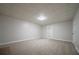 Spacious finished basement with neutral carpet and white walls, offering a versatile living space at 4495 Riders Ridge Trl, Snellville, GA 30039