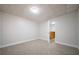 Finished basement has neutral carpet, light and access to the rest of the house at 4495 Riders Ridge Trl, Snellville, GA 30039