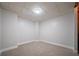 Finished basement area featuring new carpet, fresh paint, and ample room for activities at 4495 Riders Ridge Trl, Snellville, GA 30039
