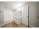 Newly renovated bathroom with tub, modern vanity, new flooring, and bright lighting at 4495 Riders Ridge Trl, Snellville, GA 30039