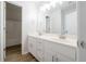 Well-lit bathroom featuring double sinks and a separate room containing the shower and toilet at 4495 Riders Ridge Trl, Snellville, GA 30039