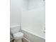A full tub and shower unit in a bright, clean bathroom at 4495 Riders Ridge Trl, Snellville, GA 30039