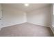 Spacious empty bedroom painted in neutral colors, offering a blank canvas to personalize at 4495 Riders Ridge Trl, Snellville, GA 30039