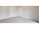 Bright bedroom with neutral carpet features multiple closets and abundant space at 4495 Riders Ridge Trl, Snellville, GA 30039